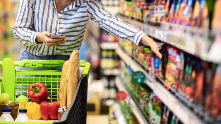 Portrait,Of,Millennial,Lady,Holding,And,Using,Smartphone,Buying,Food
